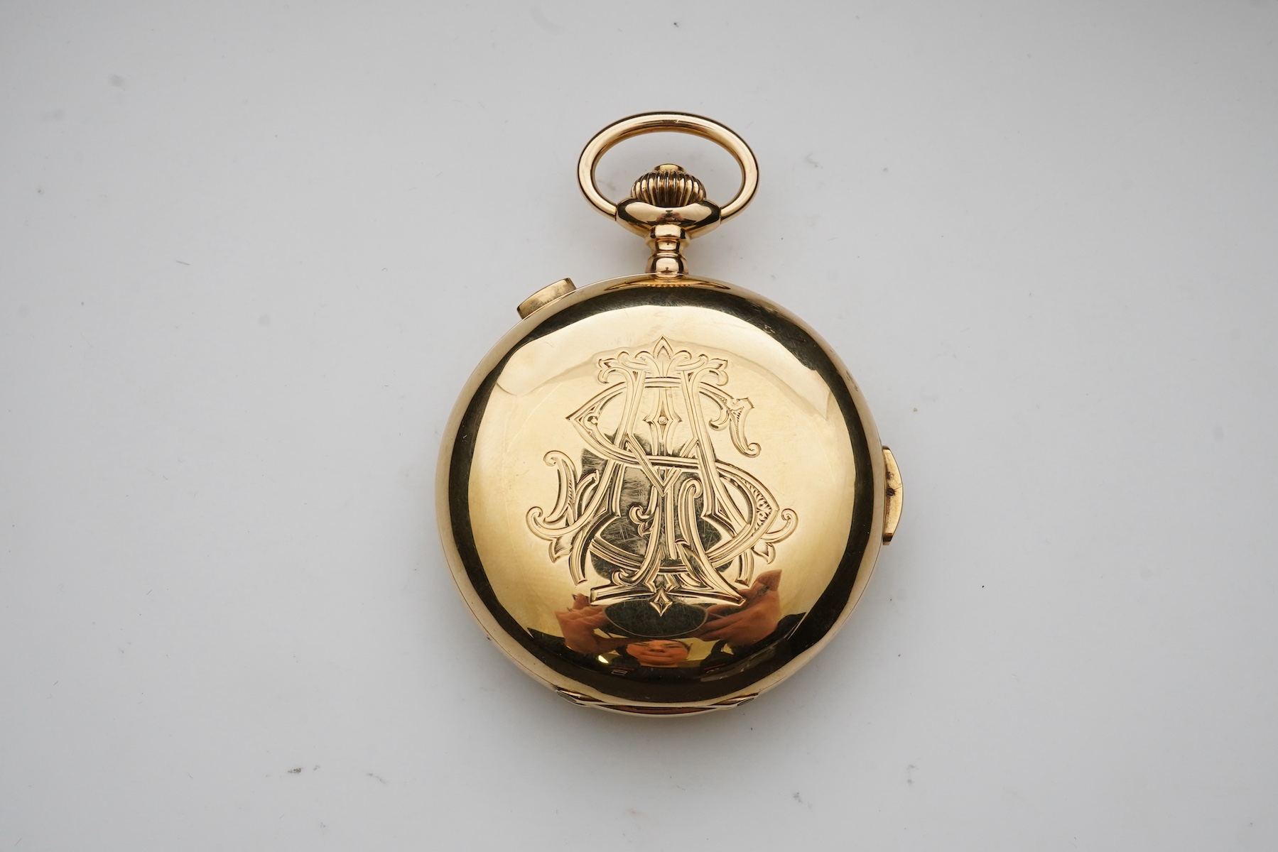 An 18k gold keyless wind triple calendar minute repeating chronograph full hunter pocket watch with moon phase